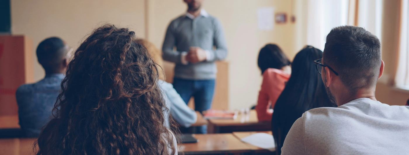 A teacher standing before a class